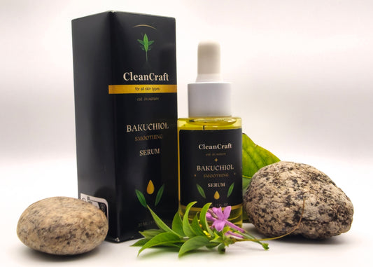 CleanCraft Organics Bakuchiol Smoothing Serum bottle and box with dropper, styled with stones and greenery